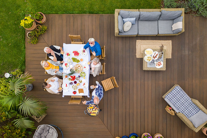 plan-your-patio_group-of-people-enjoying-patio – Mares & Dow Construction & Skylights